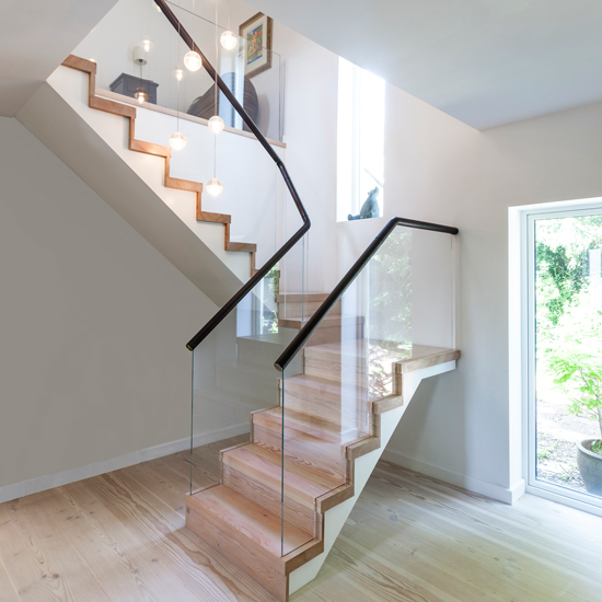 wooden staircase with wooden flooring