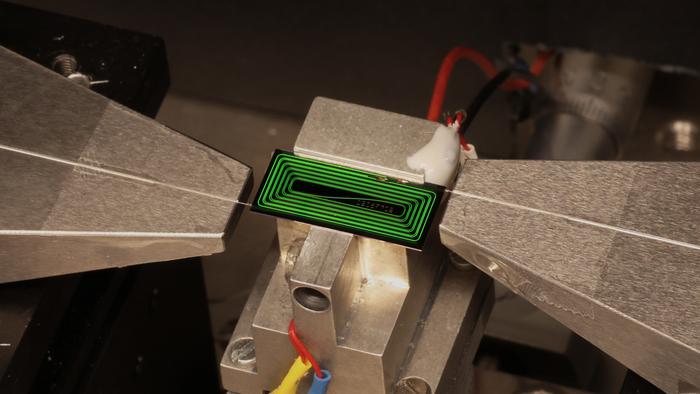 Ultrafast laser squeezed onto a tiny photonic chip in field's 'holy grail' breakthrough