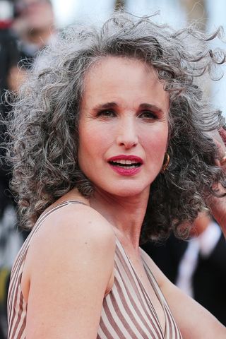 Andie MacDowell has grey and black hair as she attends the screening of "Mother And Son (Un Petit Frere)" during the 75th annual Cannes film festival at Palais des Festivals on May 27, 2022 in Cannes, France.