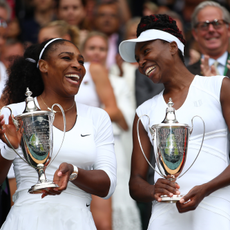 Venus Williams of The United States and Serena Williams of The United States hold their trophies following victory in the Ladies Doubles Final against Timea Babos of Hungary and Yaroslava Shvedova of Kazakhstan on day twelve of the Wimbledon Lawn Tennis Championships at the All England Lawn Tennis and Croquet Club on July 9, 2016 in London, England.