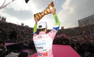 To the victor the spoils... Ivan Basso celebrates his second Giro d'Italia title, this time in more endearing circumstances, a fact well-noted by the Italian media (above).