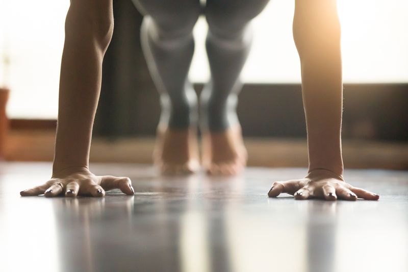 A woman in the plank pose at home