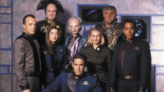 The Season 1 cast standing in Michael O'Hare's office in Babylon 5