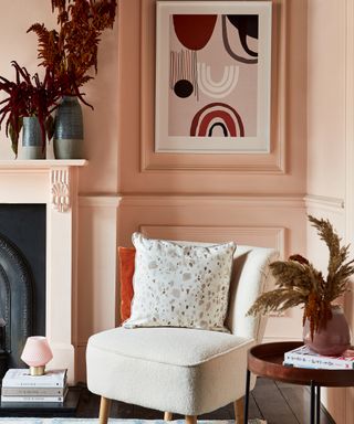 A living room corner idea with hero boucle chair, coral wall decor and abstract wall art