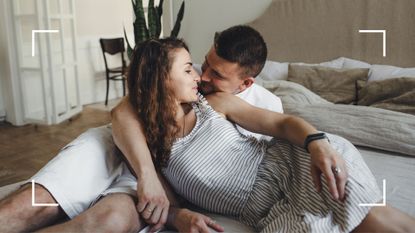 Man and woman lying on top of a bed together, almost kissing, representing the butter churner sex position