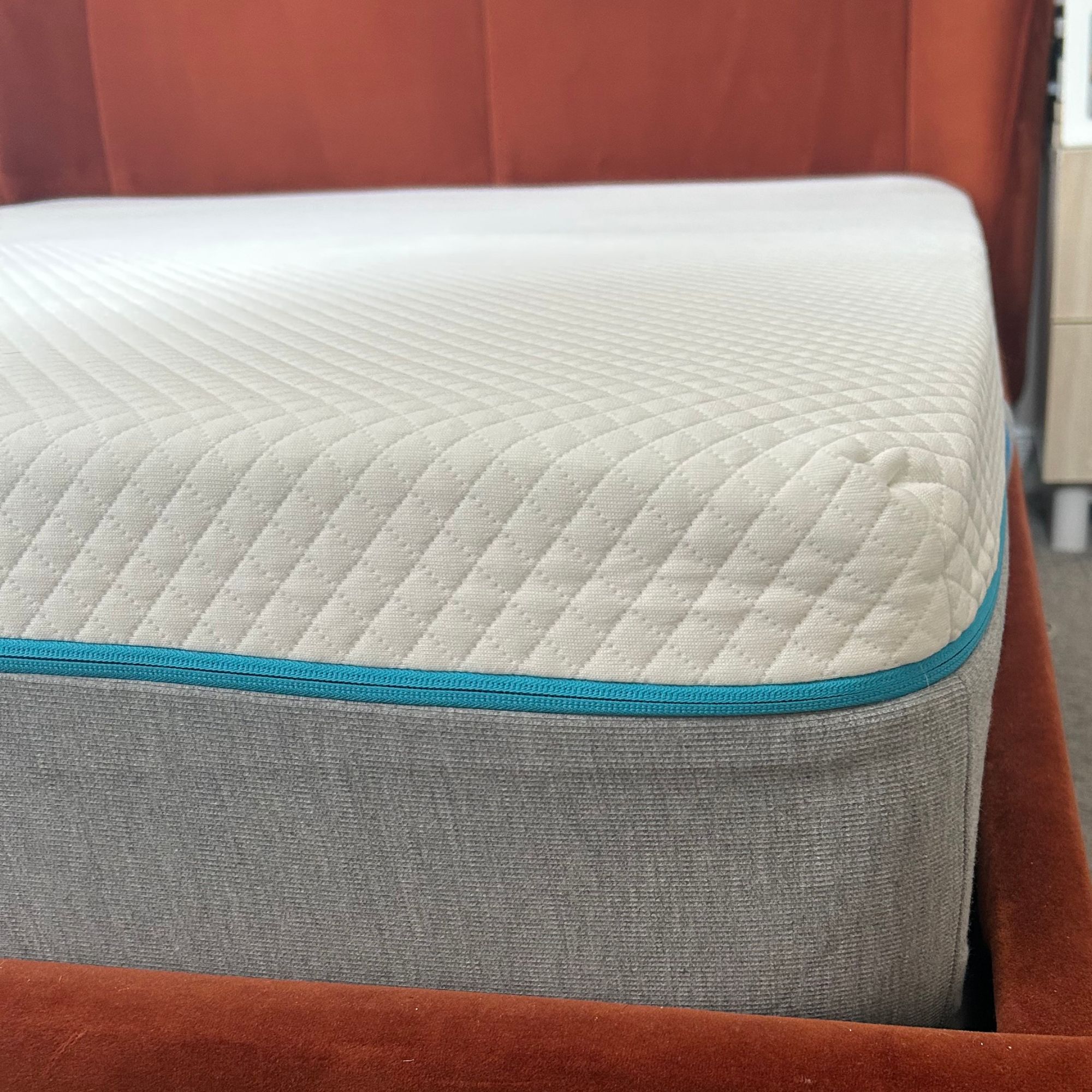 Simba mattress on red velvet bed frame, corner
