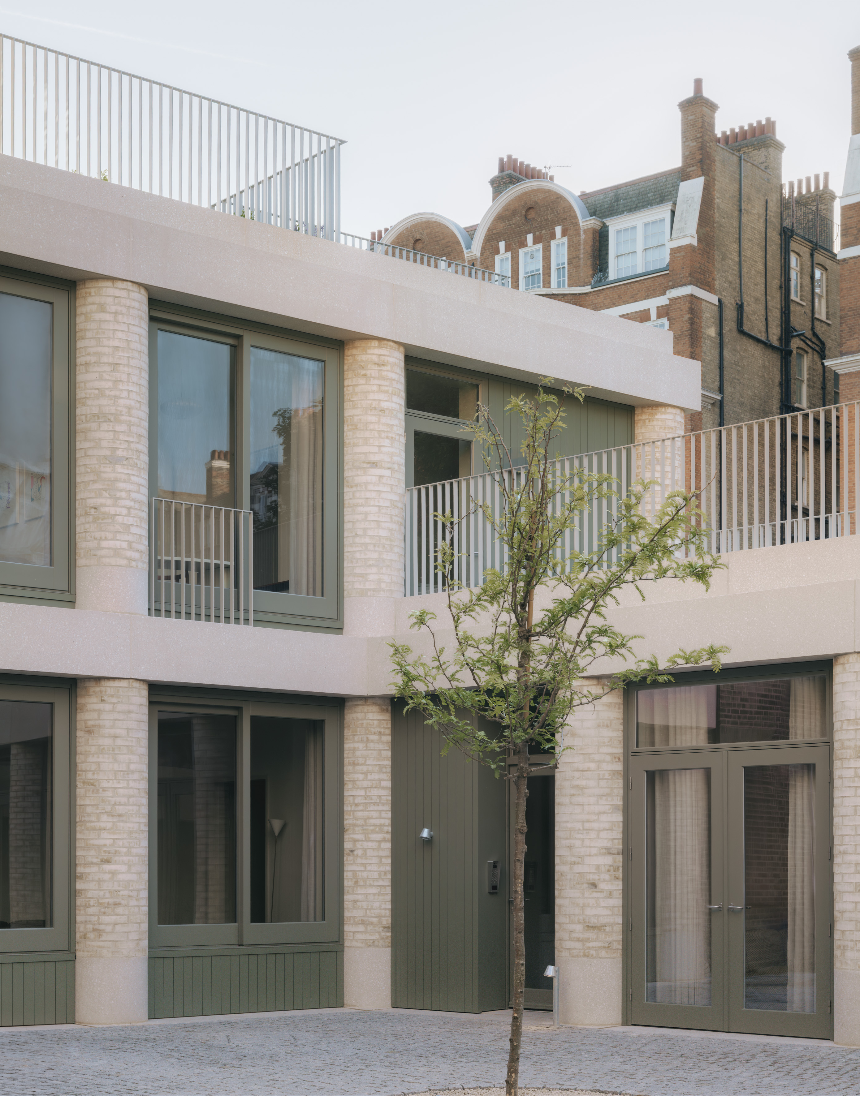 20 Newcourt Street, by Wendover, a london development of old and new with round columns and brick frontage