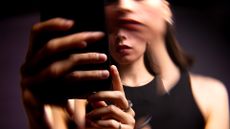 Woman doomscrolling on her phone