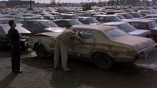 The Dude finds his tapes stolen from his Gran Torino in a car lot in The Big Lebowski