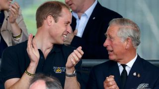 Prince William and King Charles watch the athletics during the Invictus Games