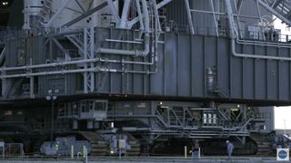 Technicians during the rollout were dwarfed by Crawler-Transporter 2, which carried Orion and SLS to the launch pad.