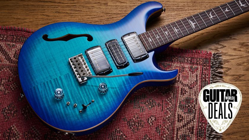 A PRS SE Special Semi Hollow electric guitar on a rug