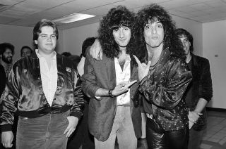 The new guy: Bruce Kulick (centre) and Paul Stanley (right) with 'That Metal Show' host Eddie Trunk in New York, 1985
