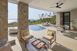 Mandarin Oriental Costa Navarino view of private terrace and pool in room