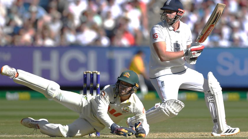 England tailend batsman Gus Atkinson gets a ball away watched by a sprawling Alex Carey, the Australian wicket-keeper, during the 4th Test 