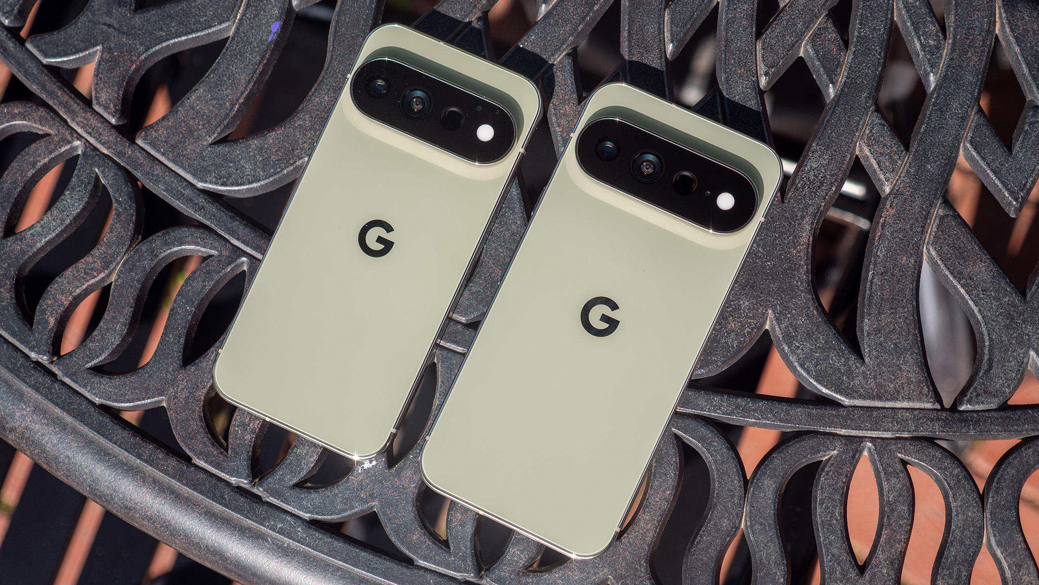 The back of the olive green Google Pixel 11 Pro and Pixel 11 Pro XL next to each other