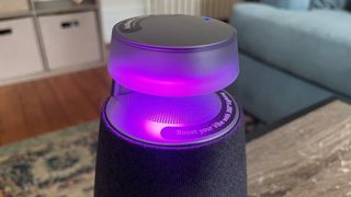 LG XBoom XO2T speaker, illuminated, in a listening room