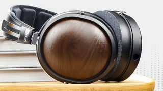 Fiio FT1 headphones on a stool, showing the wooden ear cups