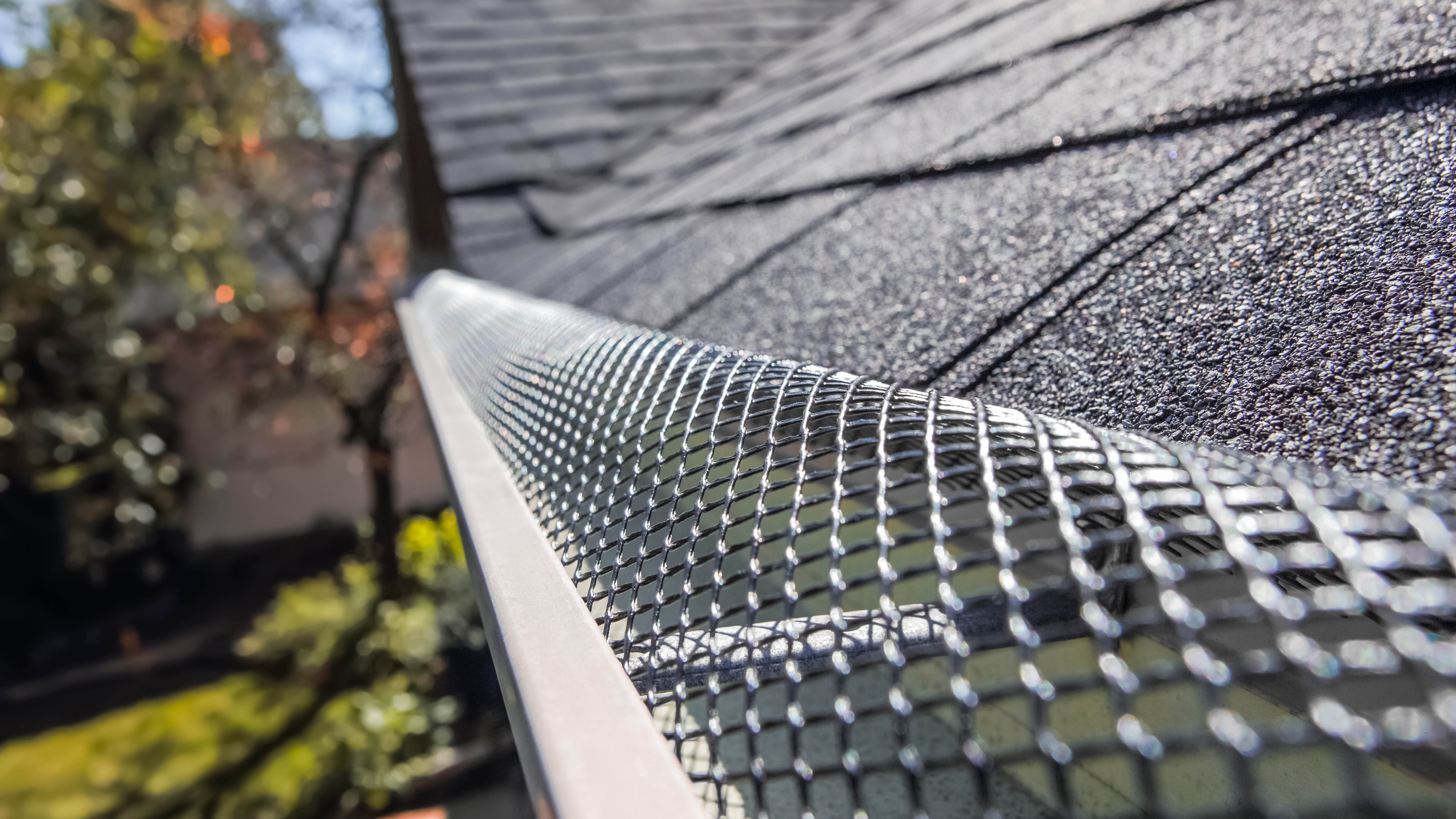 A gutter that has been covered with a gutter mesh