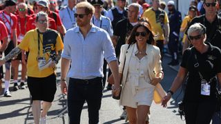 Prince Harry, Duke of Sussex and his wife Meghan Markle attend the Invictus Games