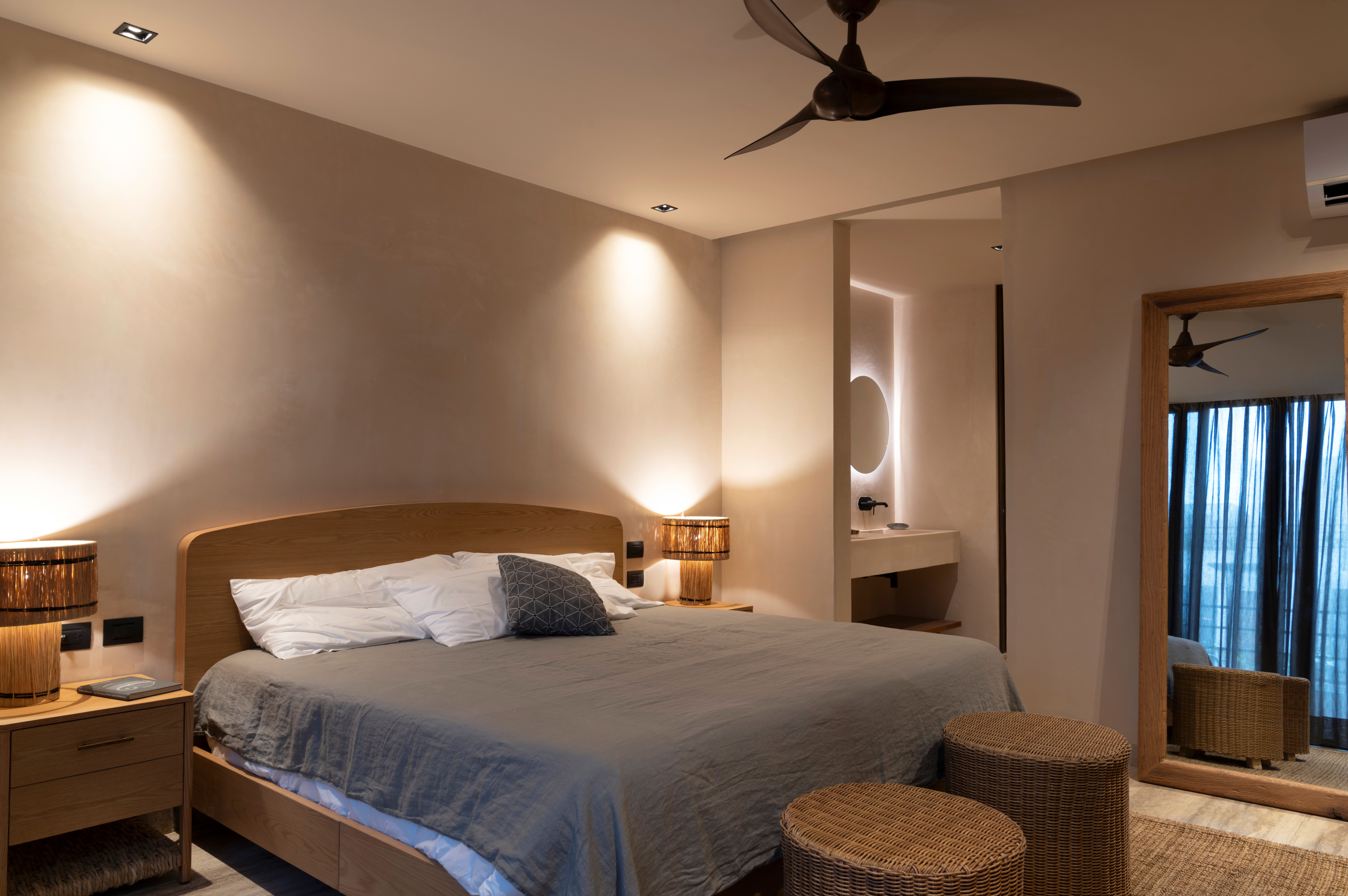 Bedroom with ceiling fan and wooden furniture