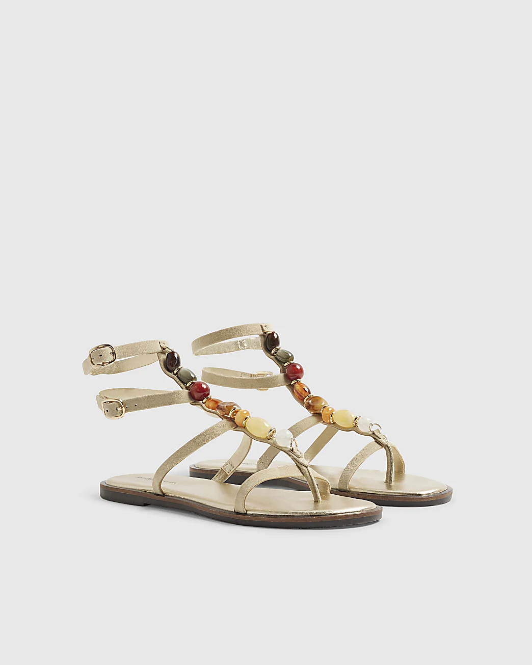 A pair of cream River Island beaded gladiator sandals.