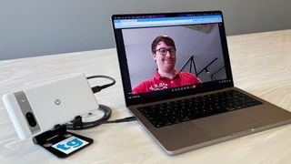 A MacBook Pro using a Pixel 7a as a webcam