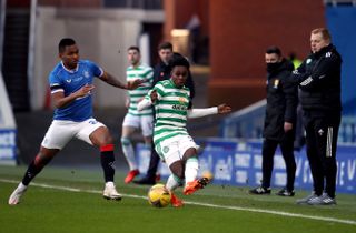 Alfredo Morelos, left, and Jeremie Frimpong battle for the ball
