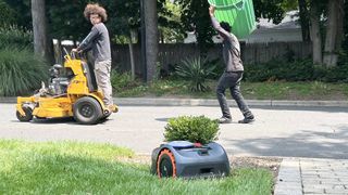 Landscapers pass by Navimow