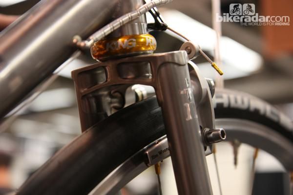 The fork crown on this Naked fat-tired road bike is nice in and of itself but look closer at how the brake mounts are attached. Awesome.