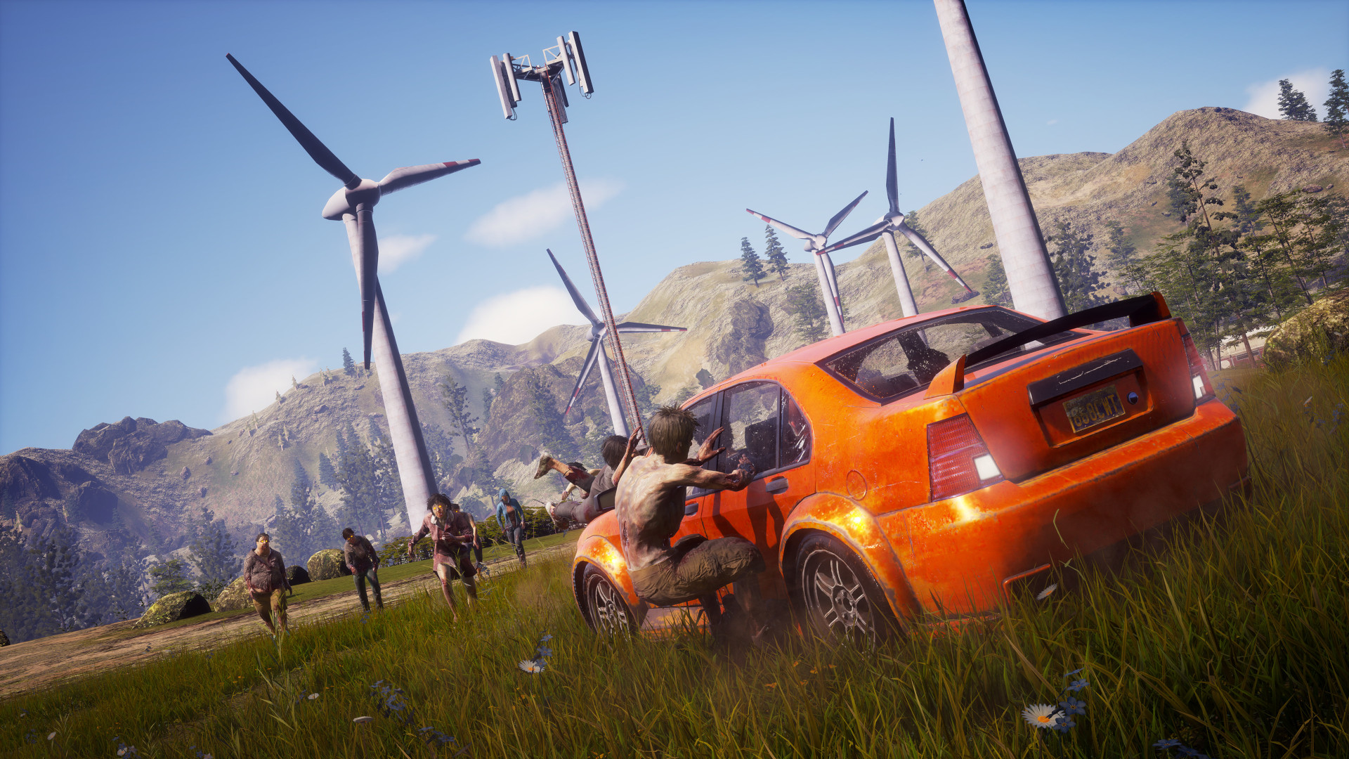 A horde of zombies running towards an orange car with Windfarm in the background