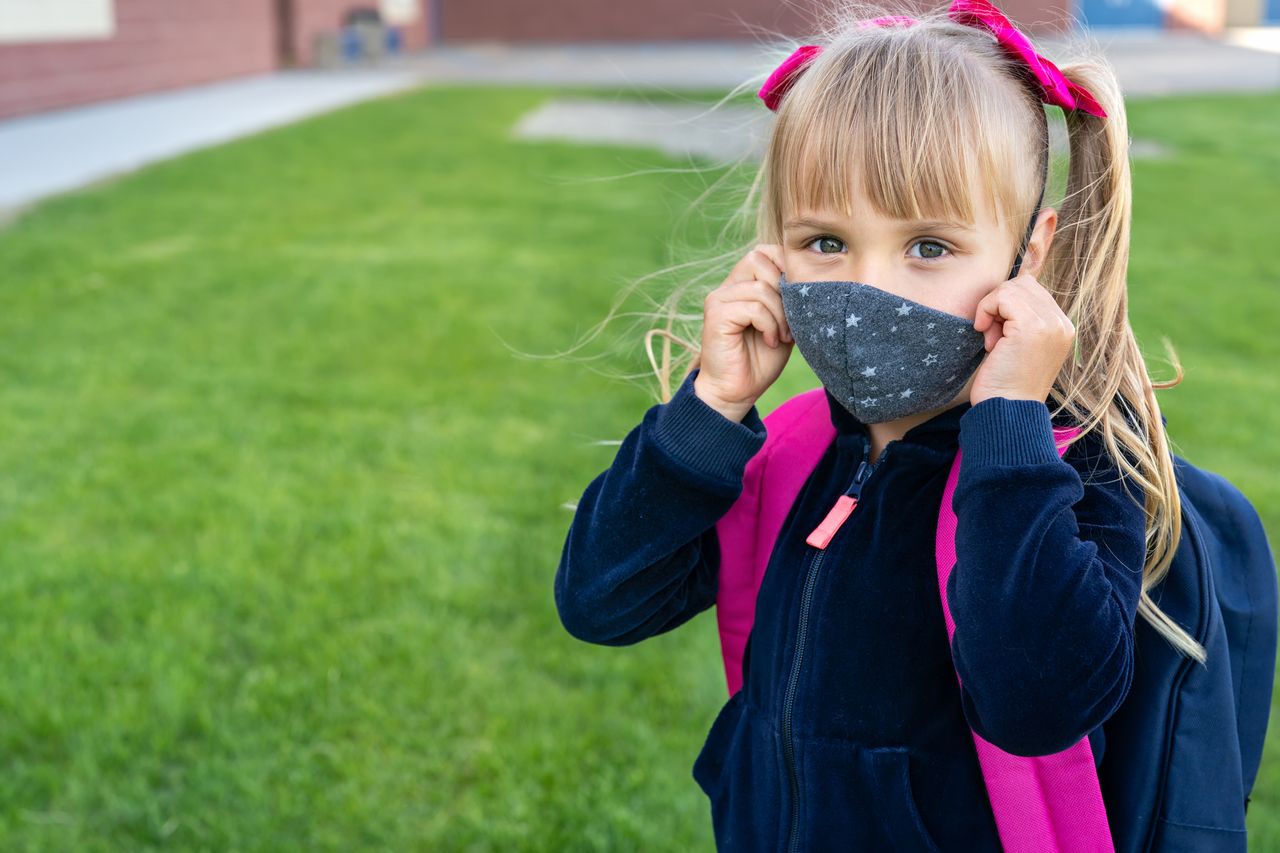 A girl wearing a mask.