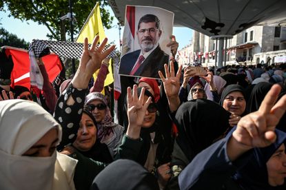 Egyptians mourn former president Mohamed Morsi.