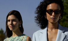 Two models wearing clothing sold at Whistles