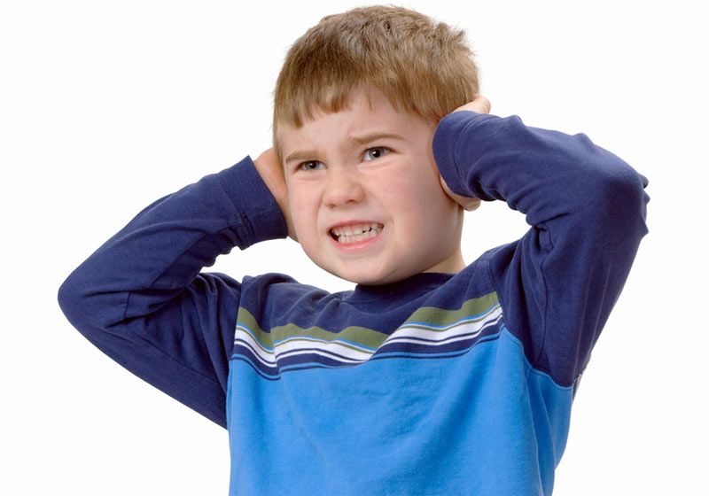 Child Covering His Ears with Hands 