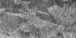 A close up of the full length of Valles Marineris, a 'Grand Canyon' of Mars and the largest canyon system in the solar system, which is nearly 2,500 miles (4,000 kilometers) long.