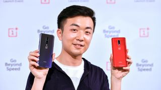 photo of carl pei holding two oneplus 6 phones