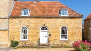 stone building with shrubbery