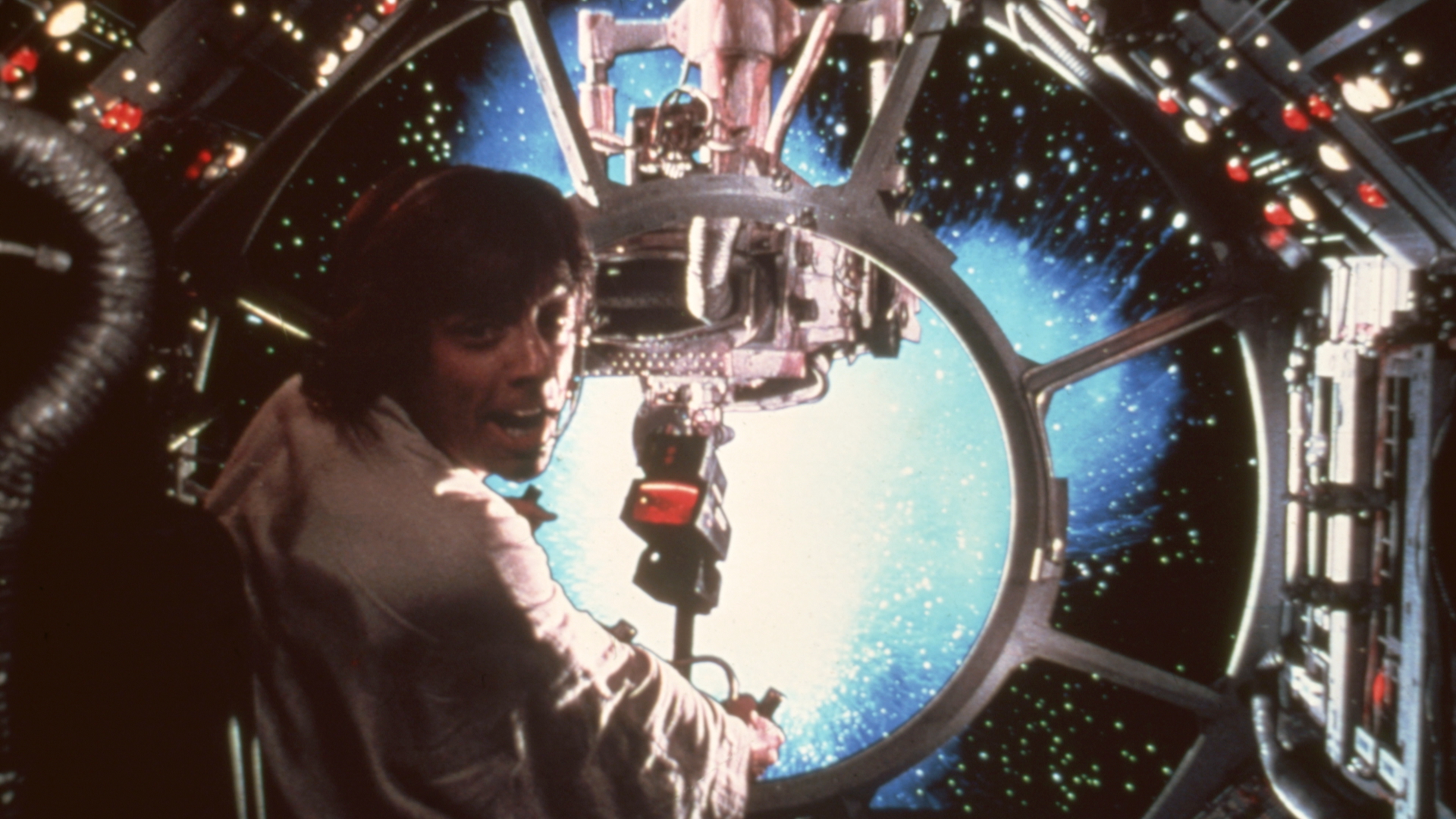 Mark Hamill as Luke Skywalker firing a weapon in a space battle in a scene from George Lucas 1977 classic 'Star Wars: Episode IV - A New Hope'.