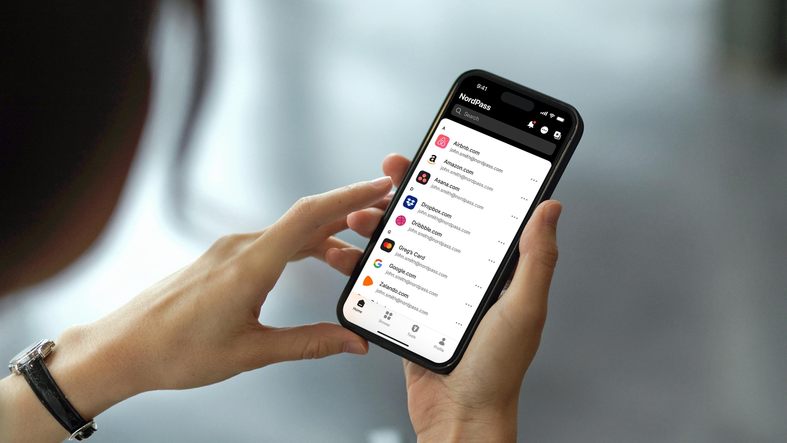 Person holding iPhone using NordPass