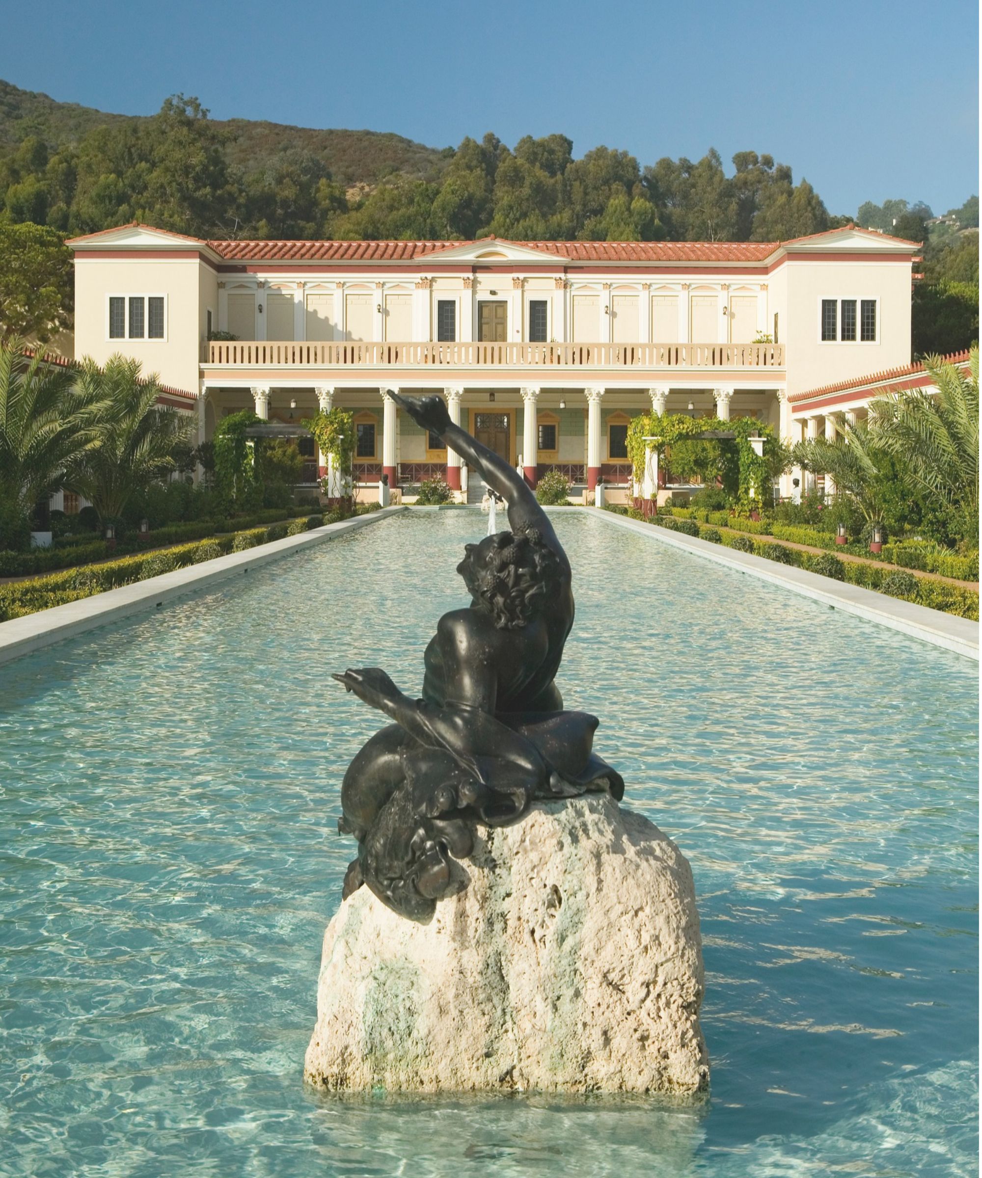 The Getty Villa beyond a water feature