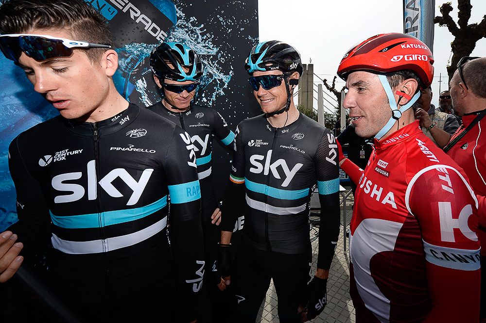 Joaquin Rodriguez greets the Team Sky riders