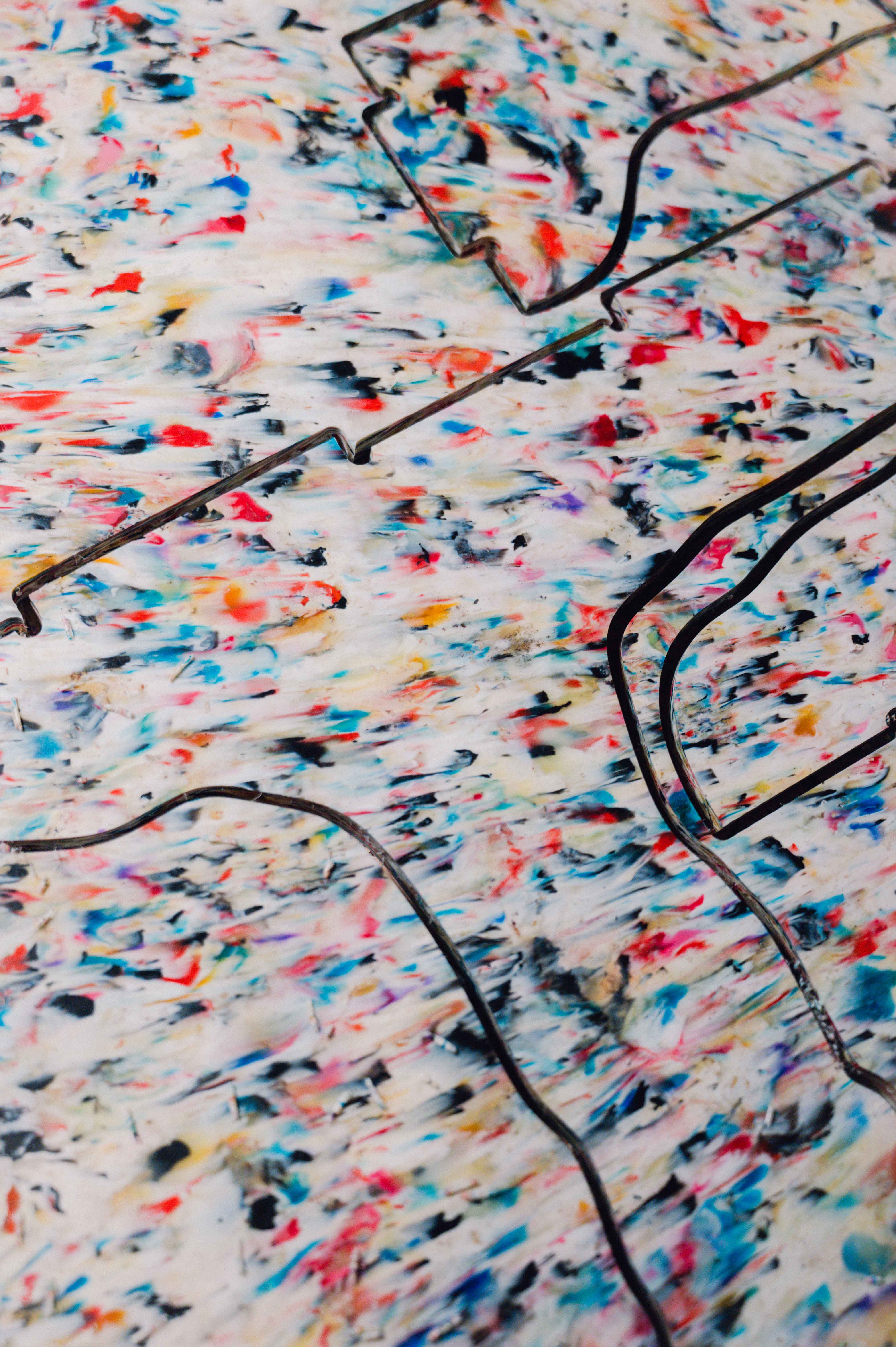 Colourful plastic sheet with lines cut into it
