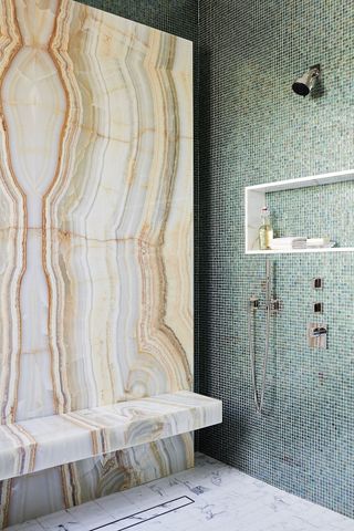 modern bathroom with a statement shower in marble tiles