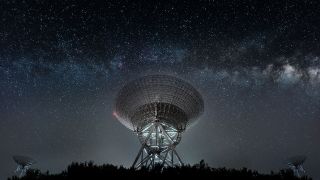 Radio telescope dishes pointed towards the milky way galaxy