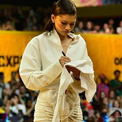 Zendaya in a white Schiaparelli Lobster Skirt and button-down shirt