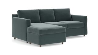 A contemporary soft green velvet sleeper sectional from Crate & Barrel