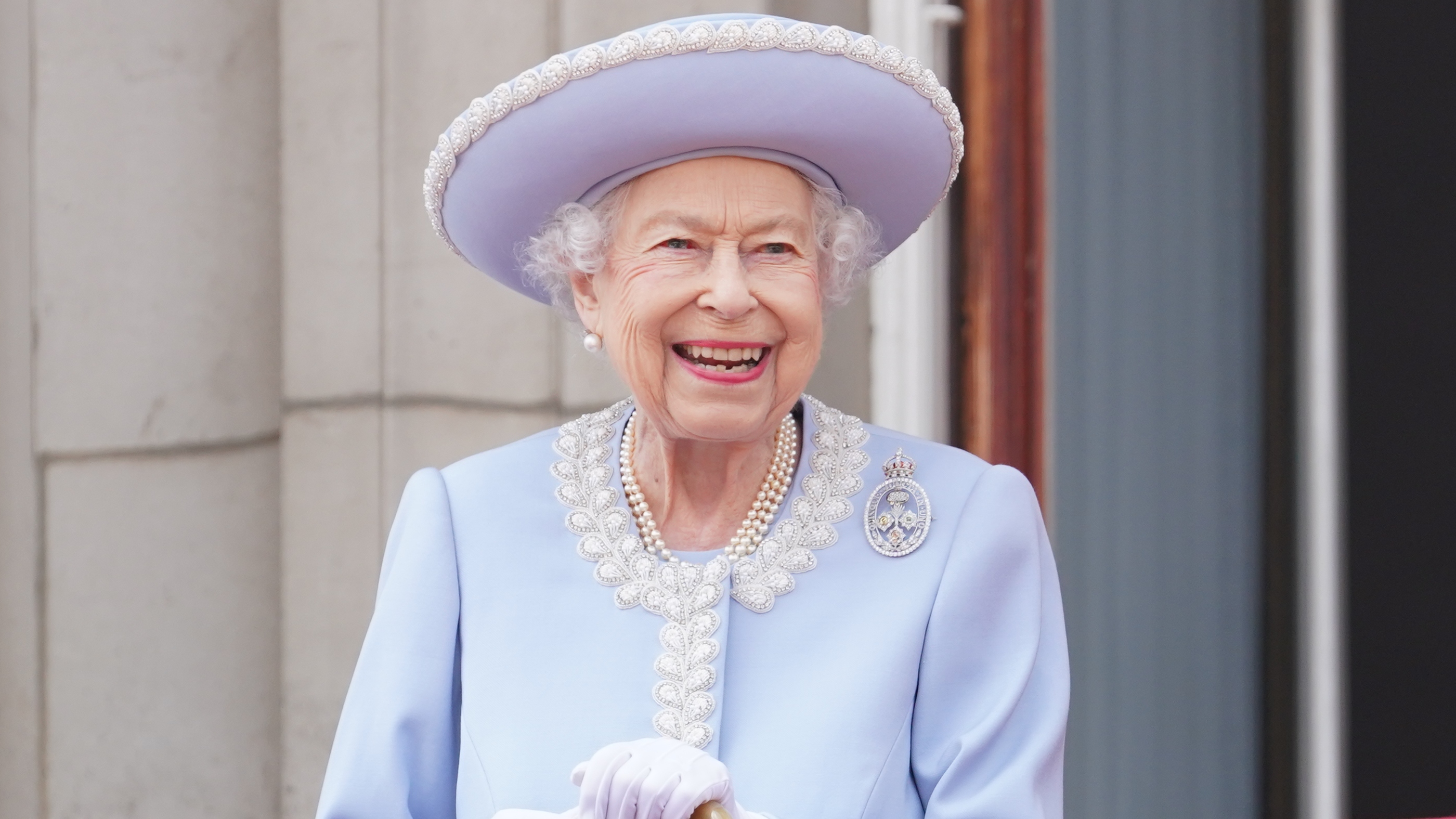 Queen Elizabeth II watches from the balcony of Buckingham Palace during the Trooping the Colour parade on June 2, 2022