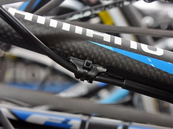 Felt's top-end F1 frames aren't specifically Shimano Dura-Ace Di2-ready so instead, the company provides the team with drilled-out cable guides that are slotted for zip-ties.