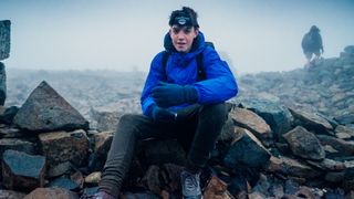 A teenage hiker in the rain on Ben Nevis